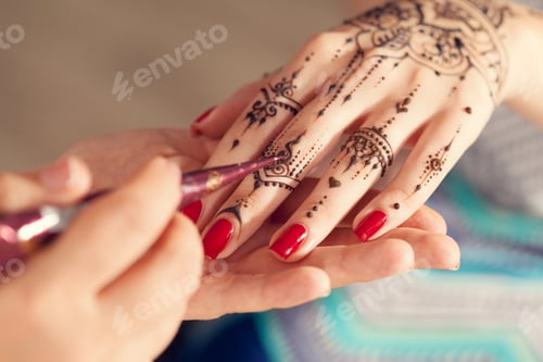 Preview: Process of applying mehndi on female hands