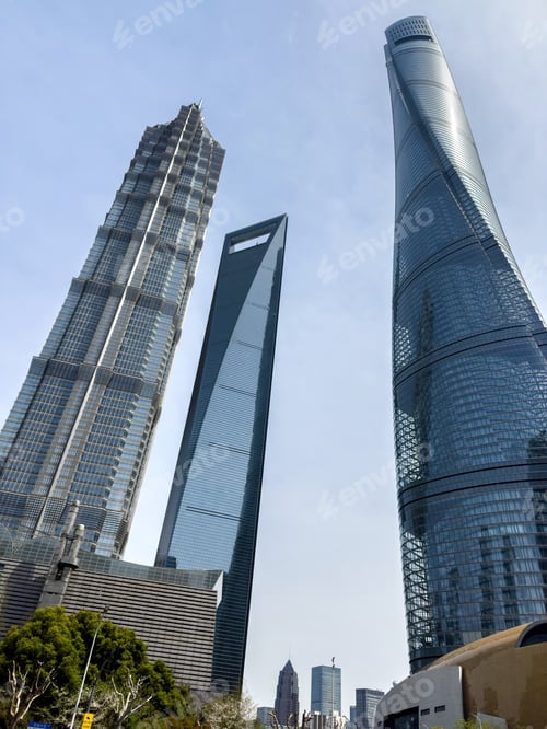 Preview: Shanghai city high rise buildings against blue sky, China. Business skyscrapers low angle view.
