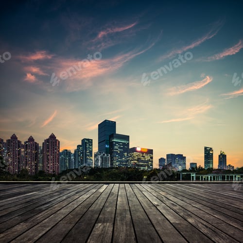 City Skyline at Sunset with Wooden Deck