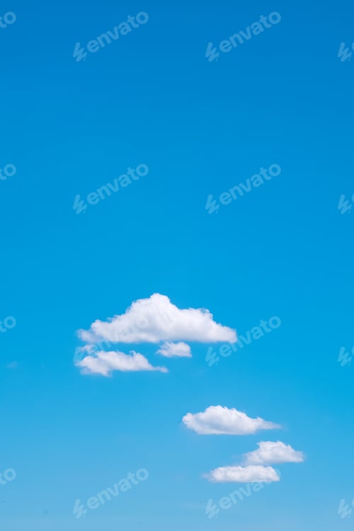 Preview: Blue sky vertical background with fluffy cloud floating on the bright summer sky in minimal style
