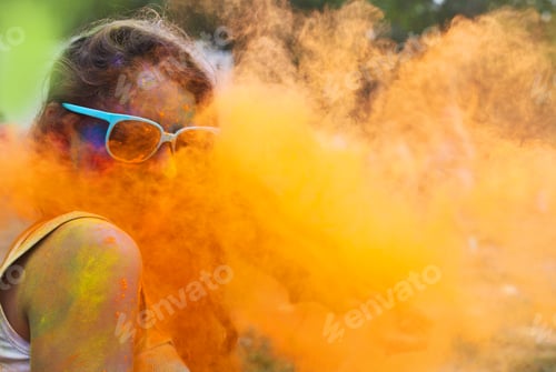 Preview: Happy young girl on holi color festival