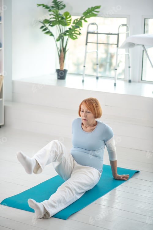 Preview: Nice active aged woman raising her leg
