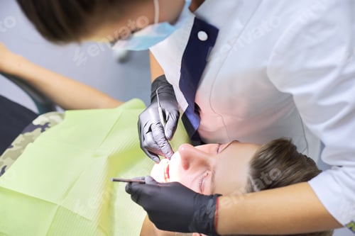 Preview: Close up dental treatment procedure in dental office
