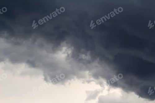 Preview: dark sky background. Dark rain clouds. Dramatic sky. Disaster weather. Copy space. Out of focus.