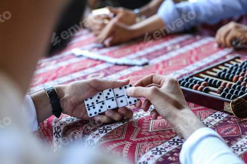 Preview: man are playing domino side view