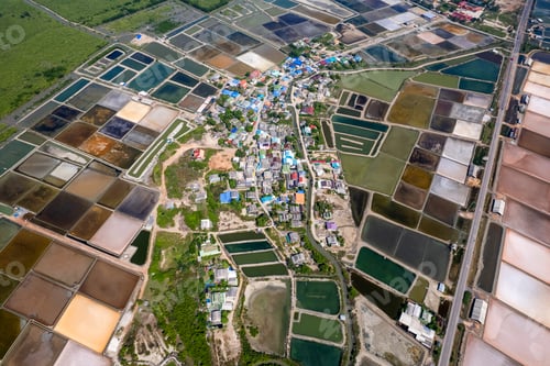 Preview: Aerial photo of local town in salt flats textures in Phetchaburi, Thailand