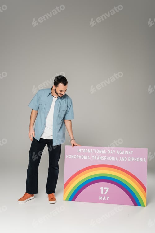 Preview: Adult Posing With LGBTQIA Pride Day Sign