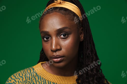 Preview: Young black woman wearing headband posing and looking at camera