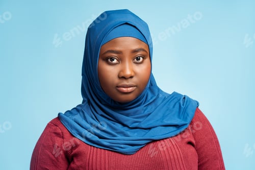 Preview: Portrait pensive islamic young woman wearing traditional stylish hijab, head scarf looking at camera