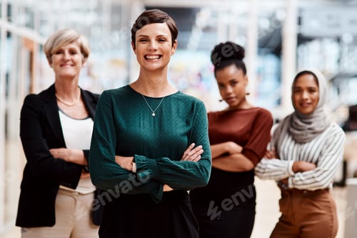 Preview: Portrait of a young businesswoman standing in an office with her colleagues in the background
