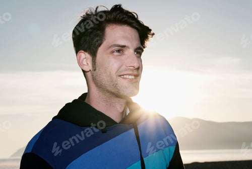 Preview: Spain, Majorca, Young man at sunset, close up