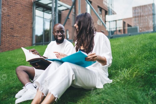 Preview: Cheerful multiracial students reading textbooks together