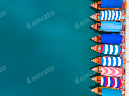 Preview: Travel Background. Colorful Boats on Lake Bled in Slovenia. Top Down Aerial View