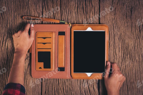 Preview: Top view Tablet computer on wood background