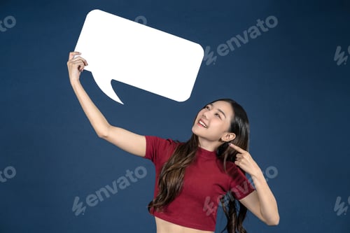 Preview: Happy young smiling Asian woman holding copy space empty message bubbles