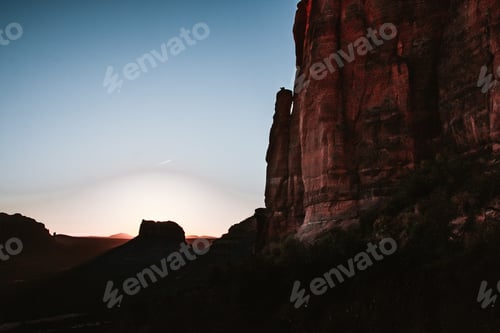 Preview: Stunning Desert Landscape at Sunset with Majestic Rock