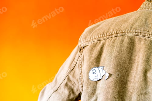 Preview: man with funny paper toy on jean jacket