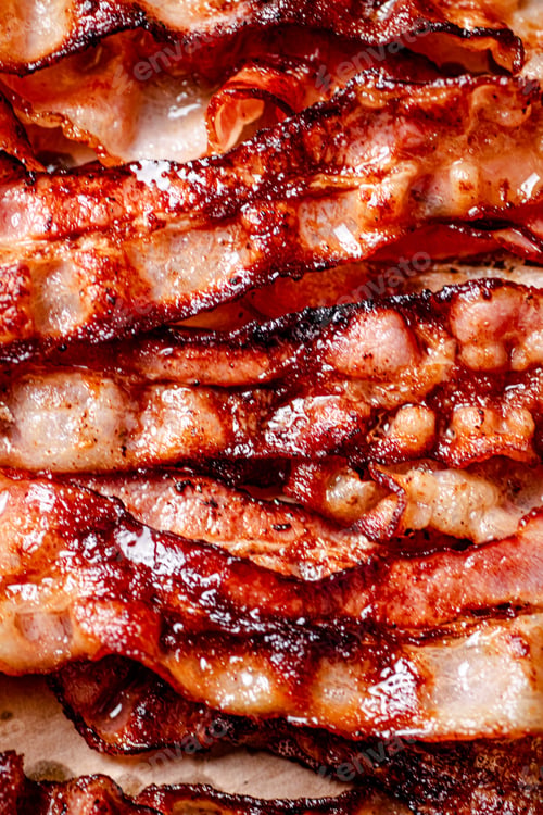 Preview: Strips of fragrant fried bacon. Macro background.