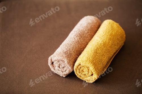 Preview: Chocolate Spa . Composition brown towel in hotel room of spa treatment