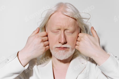 Preview: serene expression, white attire, closed eyes, calming ambiance, peaceful atmosphere A person with