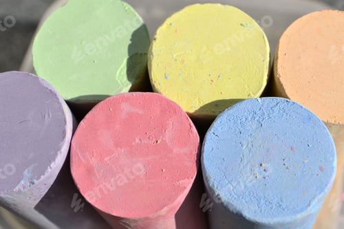 Preview: Colorful spheres of brand new sidewalk chalk. Green yellow orange purple red blue