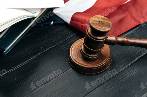 Preview: Judge gavel on the background of the flag united states of America