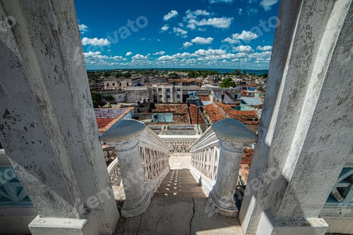 Preview: High angle shot of white stairs leading down to Cienfuegos city in Cuba