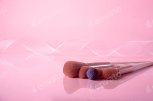 Preview: Set of makeup brushes on pink background. Makeup concept.