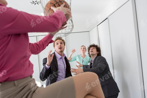 Preview: Office workers playing basketball with litter bin