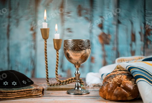 Preview: Sabbath Jewish Holiday homemade sesame challah bread and candelas on table