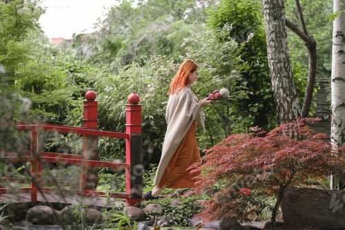 Preview: Free, happy woman middle-aged ginger hair woman in well-groomed park