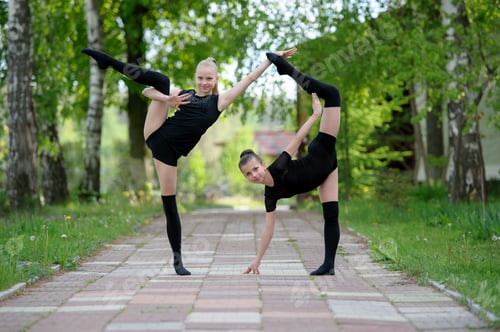 Preview: Young gymnast girls posing outdoor