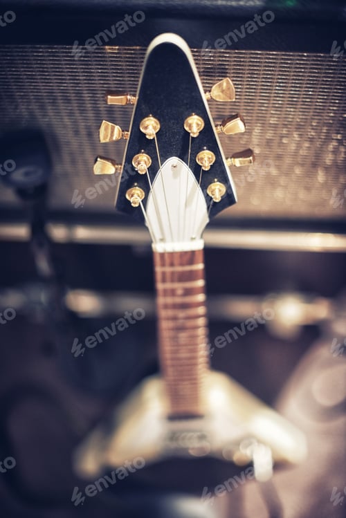 Preview: The guitar with the most sound. High angle view of a guitar leaning on an amp.