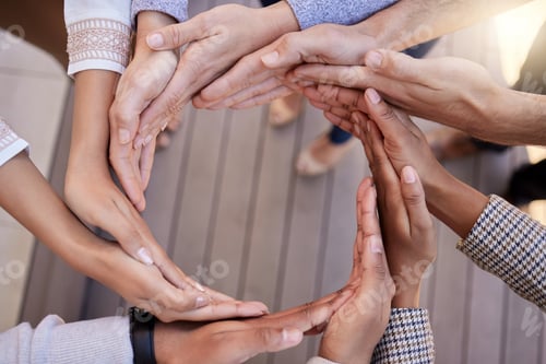 Preview: Shot of a group of unrecognizable businesspeople forming a circle with their hands outside