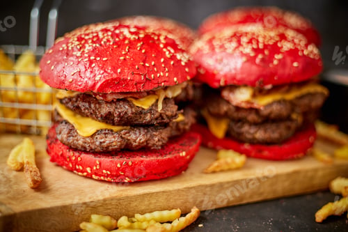 Preview: Set of four homemade giant double becon cheese burgers. Served with french fries on wooden board