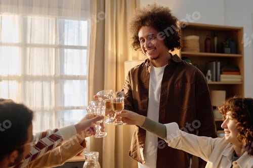 Preview: Man Clicking Glass with Friends after Proposing Toast