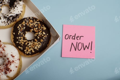 Preview: Donut Box with Order Now Note on Blue Background