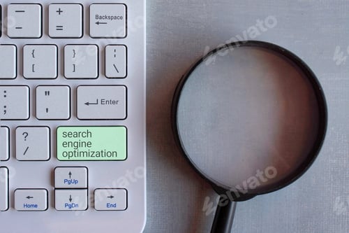 Preview: Top view image of magnifying glass and keyboard.
