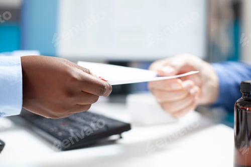 Preview: Doctor gives medical document to patient