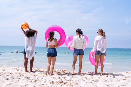 Preview: Teenage girl friendship enjoy laughing play on the blue sky sea and run to get water inflation toy
