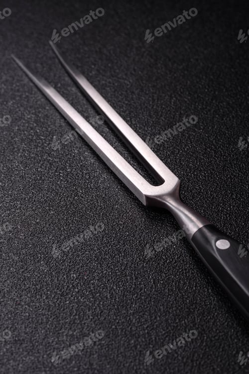 Preview: Empty meat or steak fork with vegetables, spices and other ingredients. Meat fork