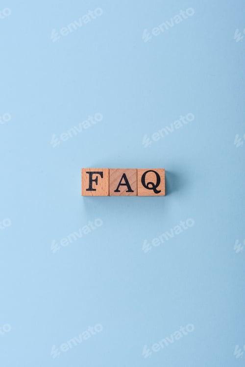 Preview: The inscription FAQ made up of wooden cubes on a plain background