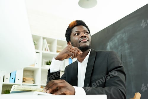 Preview: African-American Professional at Desk