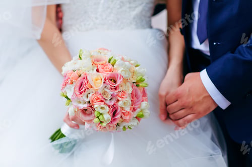 Preview: Bride hold groom by the hand and wedding bouquet.