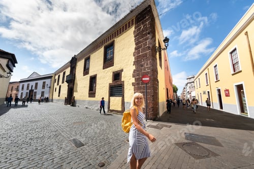 Preview: A girl in a striped dress walks through the Old Town center of La Laguna in Tenerife, Canary Islands