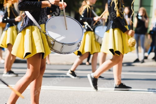 Preview: majorettes with white and blue uniforms perform in the streets of the city. photographic series