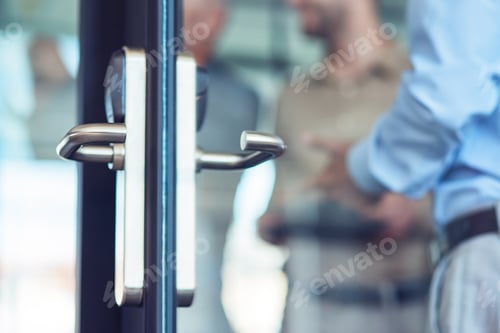 Preview: Businessman entering at work, opening glass door in the modern office, selective focus