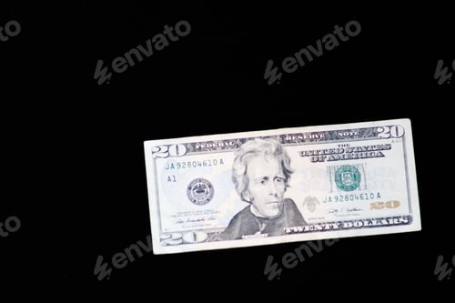 Preview: Twenty dollars isolated on black background