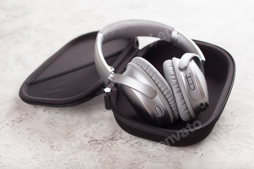 Preview: modern silver wireless headphones on concrete background