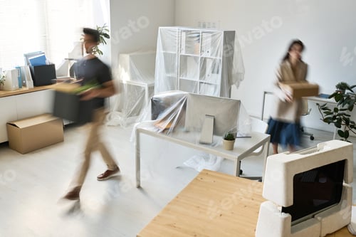 Preview: Business people carrying things during the move